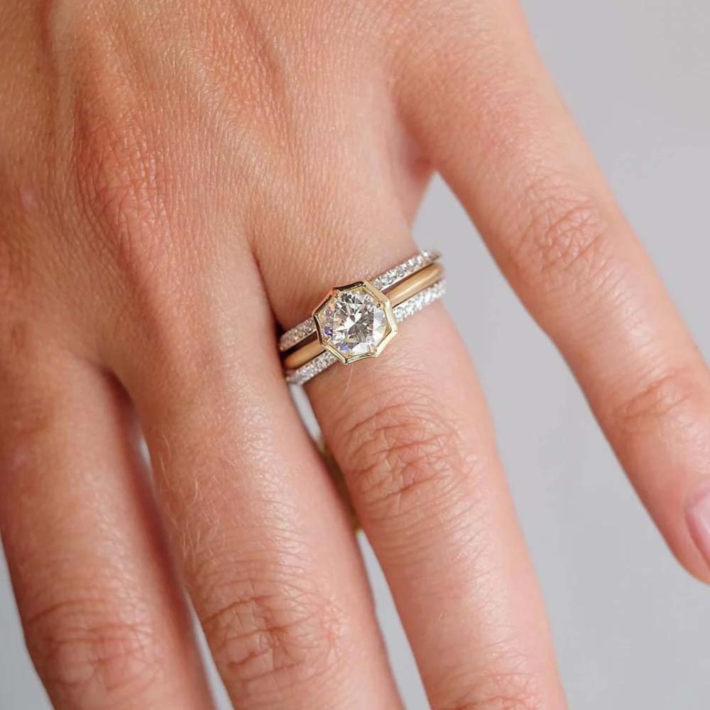 yellow gold engagement ring with solitaire diamond in bezel setting