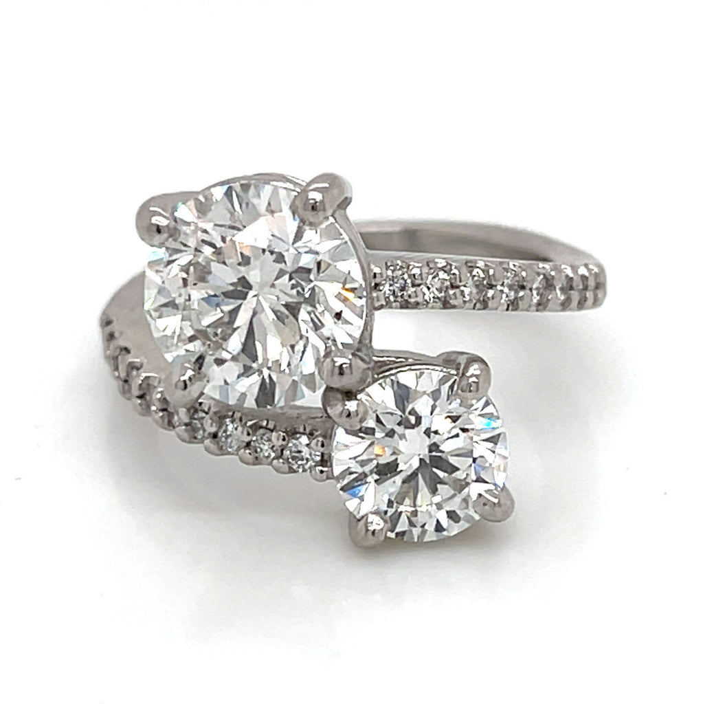custom white gold diamond engagement ring with two gemstones 