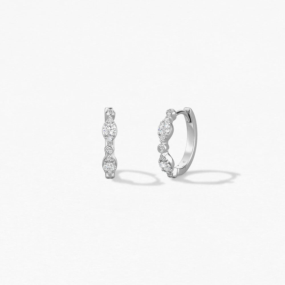 Hearts On Fire Bezel Regal Huggie