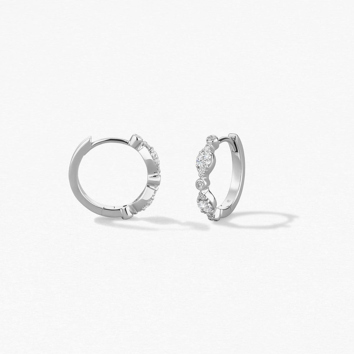 Hearts On Fire Bezel Regal Huggie