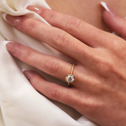 yellow gold engagement ring with solitaire diamond in bezel setting