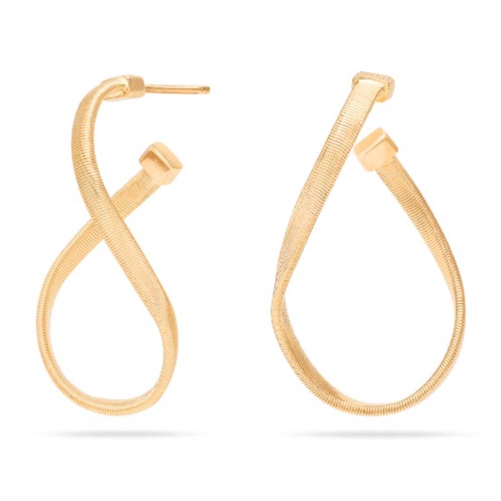 twisted irregular hoops in yellow gold